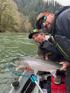Catching a rainbow trout while fishing in OR
