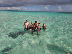 Six people having fun water sports at Rum Point