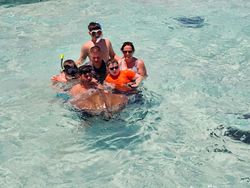 Group of 6 people enjoying water sports activities at Rum Point