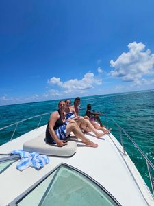 Four people enjoying water sports at Rum Point