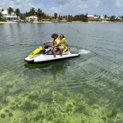 Two people enjoying water sports in Rum Point