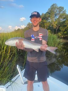 Angler holding a 19-inch fish in Mount Pleasant