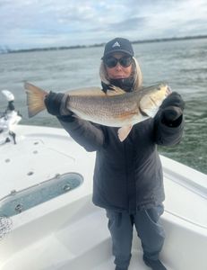 Angler reeling in a 17-inch fish in SC