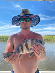Angler with a black drum fish in Mount Pleasant