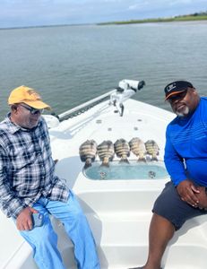 Angler in action with rod and reel on the water in SC