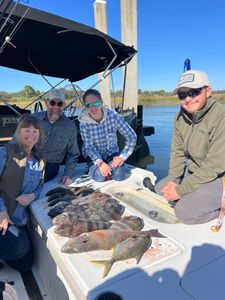 4 people fishing with rods at Mount Pleasant