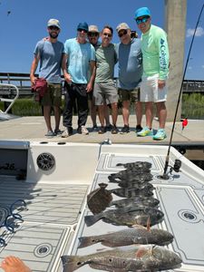 Redfish, Black Drum, and Redfish caught during fishing trip in Mount Pleasant