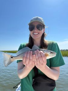Angler holding a redfish in Mount Pleasant