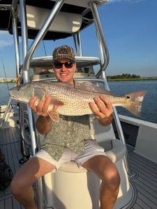 A person fishing for a redfish in Mount Pleasant