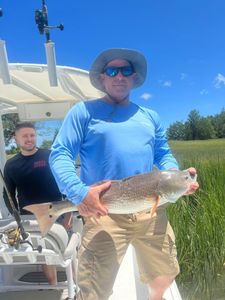 A scenic outdoor shot of 2 people fishing in SC.