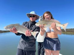 Photograph of two redfish caught during a fishing trip in South Carolina