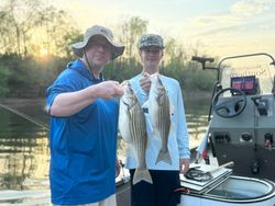Striped bass caught by two people in Weldon