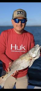 Angler with a 15-inch fish in Matagorda