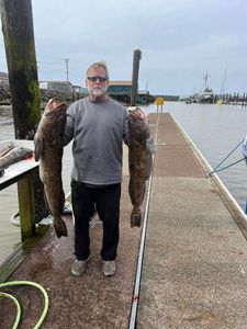 Angler fishing in Reedsport with a 30-inch fish