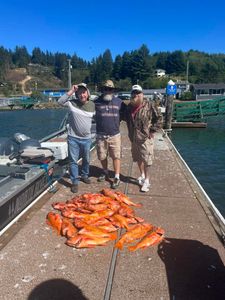 3 people enjoying a fishing trip in Reedsport