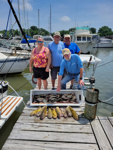 4 people enjoying a fishing and cruises excursion in Baltimore