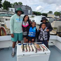 Successful fishing trip in Baltimore MD with fresh caught fish displayed on boat deck