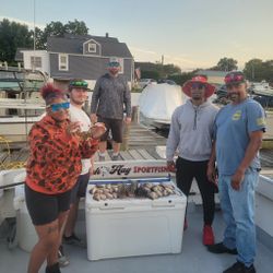 A group of 5 people enjoying a fishing cruises and fishing expedition in MD