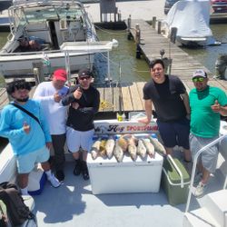 Group of 5 people enjoying a day of cruises and fishing in Maryland