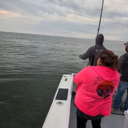 Fishing from boat deck on open water in Baltimore MD
