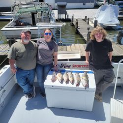 Three people enjoying a fishing and cruises adventure in Baltimore