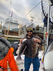 Two anglers in NJ enjoying a fishing trip
