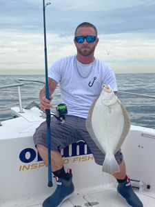Angler with large fish in Neptune City