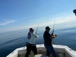 Two people fishing in Neptune City