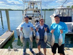 Six little tunny fish caught by four people in Neptune City