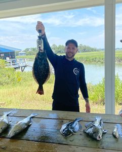 Angler fishing in Georgia with 3 fish