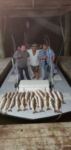 Three people fishing in the Rio Hondo