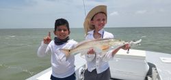 Capt. Carl and Miles caught a Red Fish