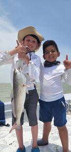 Capt Carl and Miles with a second Red Fish