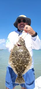 Angler with a large Southern Flounder fish in Rio Hondo