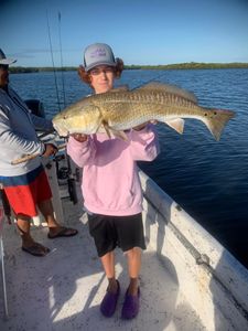 A group of 3 people fishing in FL
