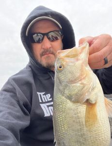 A person fishing in KY with a 17-inch fish