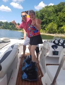 Two people on a boat enjoying fishing, cruises, tours, and water sports in Harned