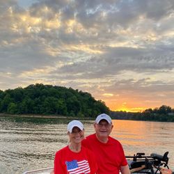 Two people fishing and enjoying water sports on the lake in Harned