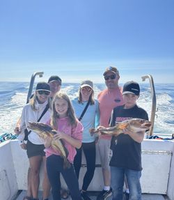 A group of six people enjoying a fishing and water sports tour in NS