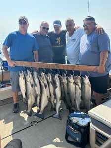 Four Chinook and Coho Salmon caught by five people fishing in South Bristol