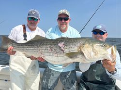 3 people fishing in Belmar, New Jersey