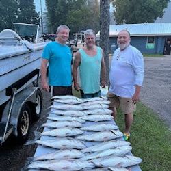 Three people enjoying fishing trip in Lexington
