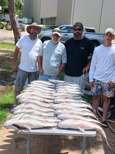 Four people enjoying a fishing trip in Lexington
