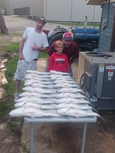 Three people enjoying a fishing trip in Lexington
