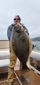 A person fishing for a California Flounder in Richmond