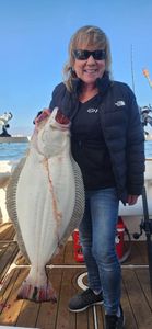 California flounder caught while fishing in Richmond CA displayed on boat deck
