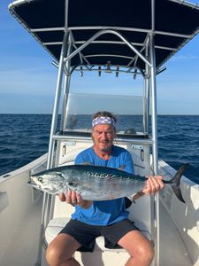 A fisherman with a little tunny fish catch in Hobe Sound