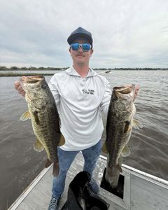 Angler holding two large fish in Florida