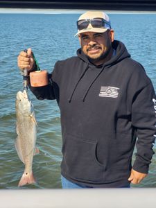 Angler with a 14-inch fish in TX