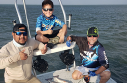 Three people fishing in TX
